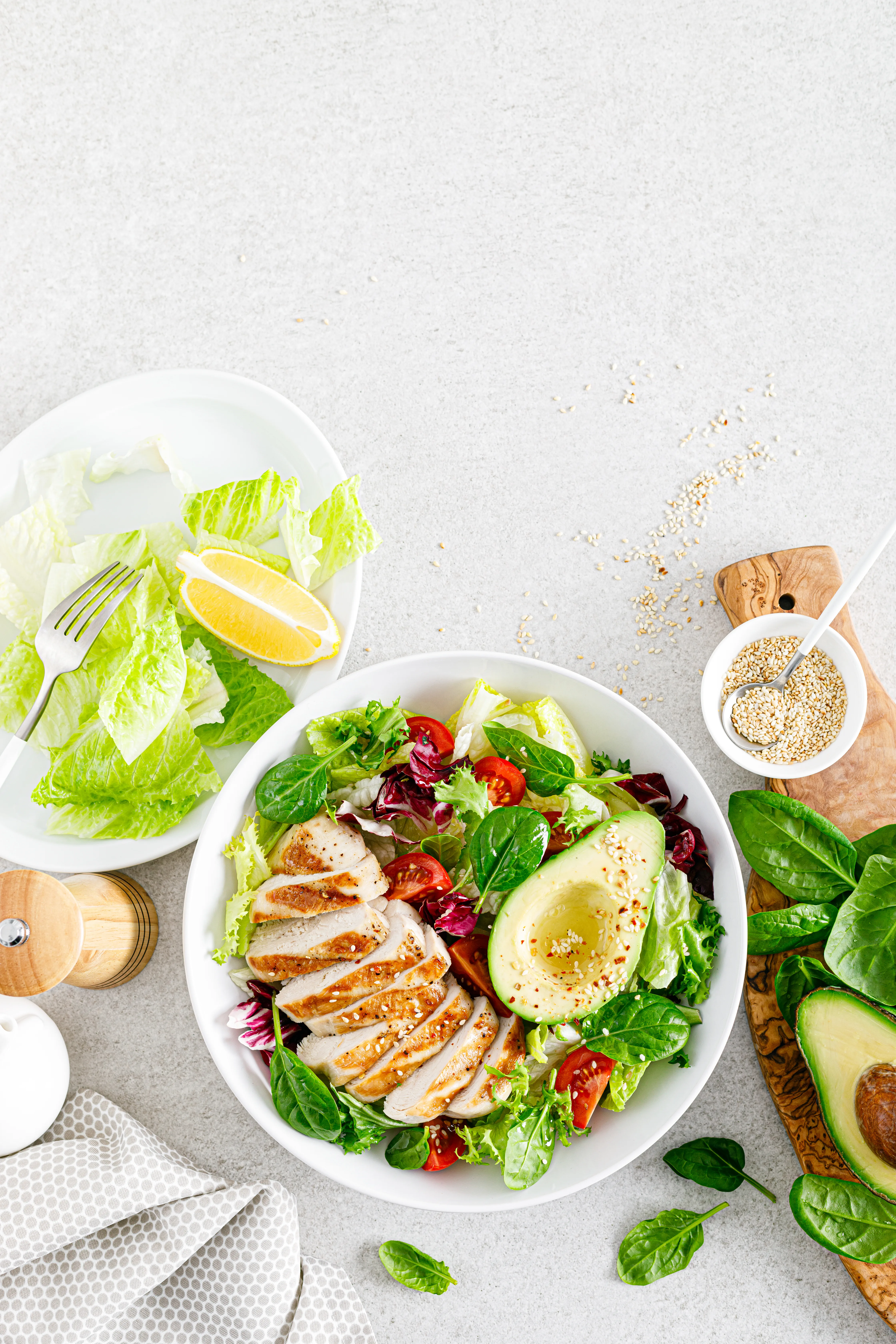 A weekly meal planning notebook surrounded by simple fresh ingredients
