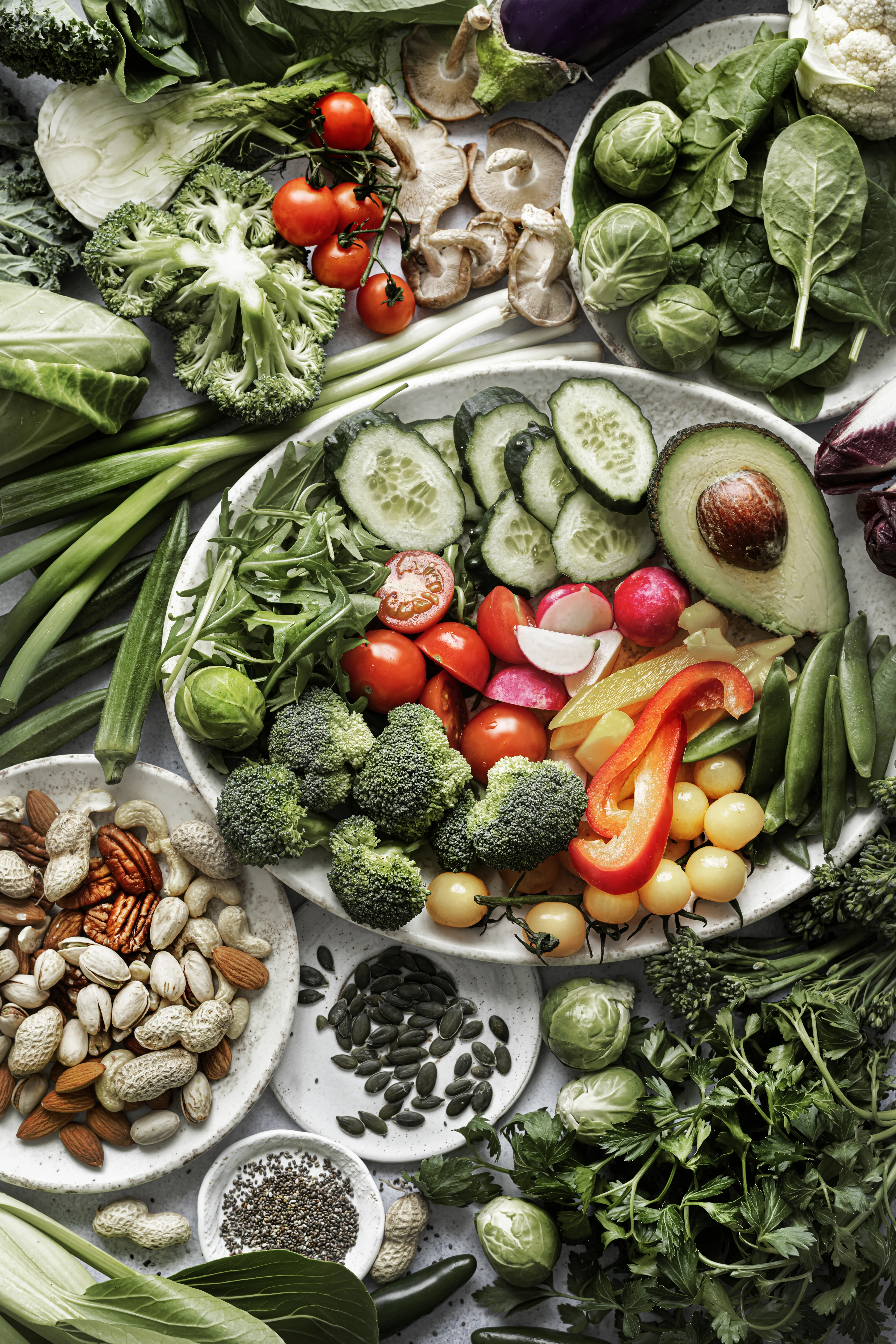 A seasonal selection of colourful vegetables and fruits arranged in a market basket
